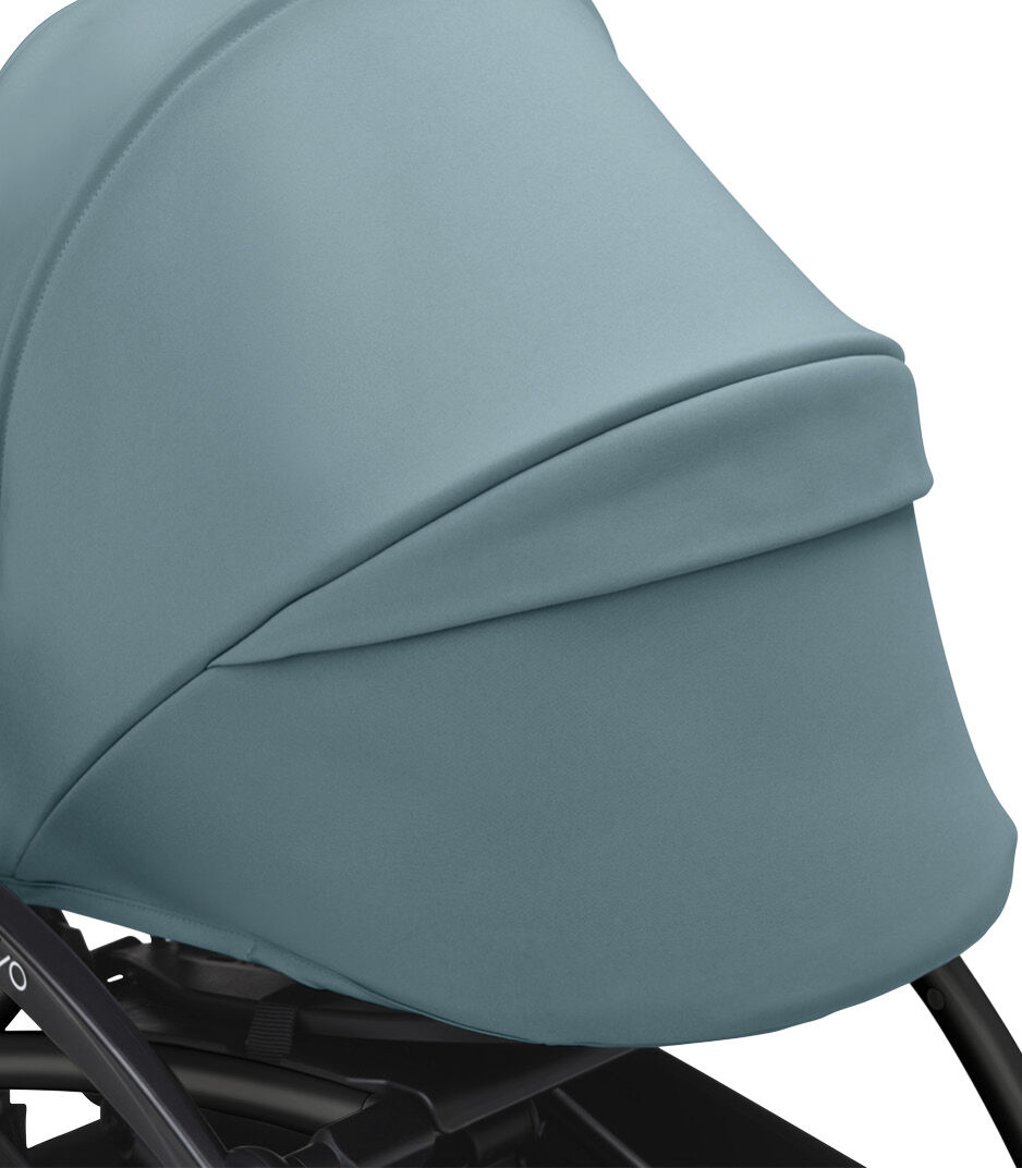 Stokke® YOYO3® 0+ Aqua. Black Frame. Canopy ventilation closed. Close-up. Angled. galery image 4